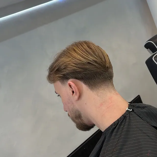 A mid-length cut with a taper, from behind