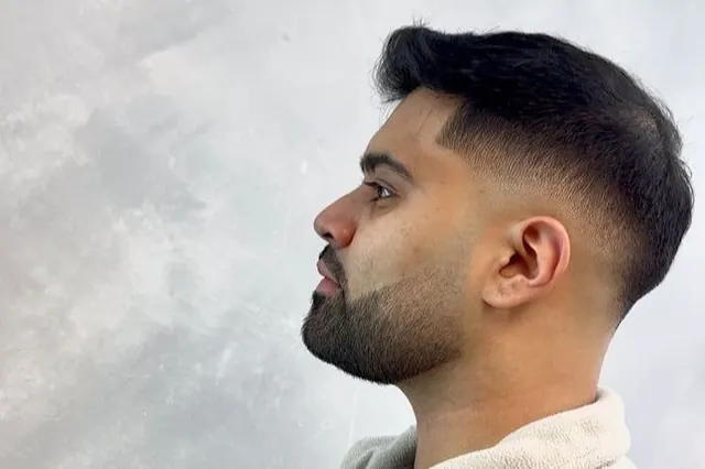 A crop with a fade and a beard